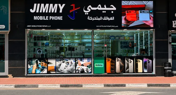 The Jimmy Mobile Phone Repair shopfront on the street in Al Barsha 1, Dubai